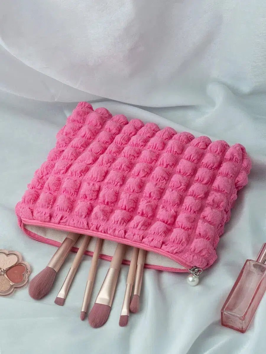 trousse de voyage rose en tissu matelassé