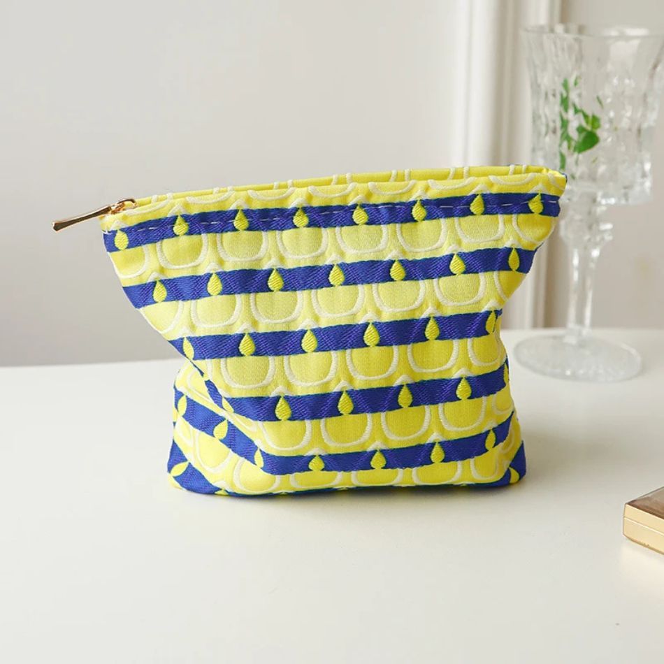 trousse de voyage design plumes de paon
