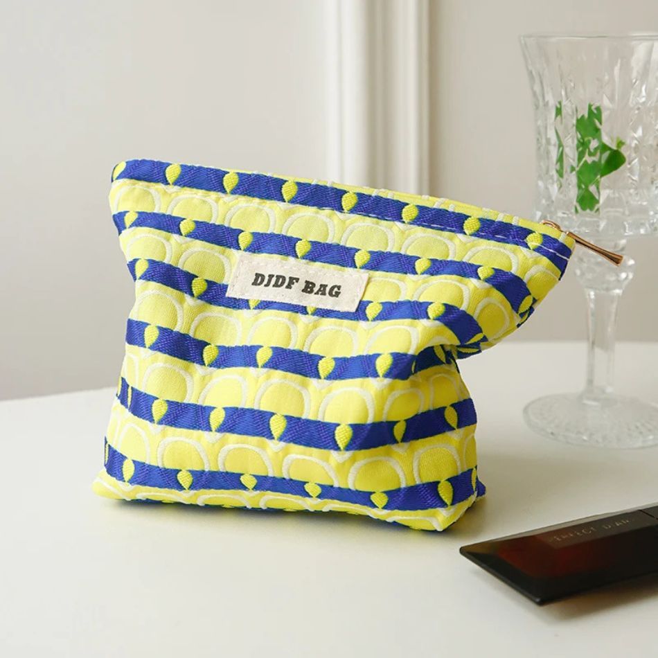 trousse maquillage motifs plumes de paon
