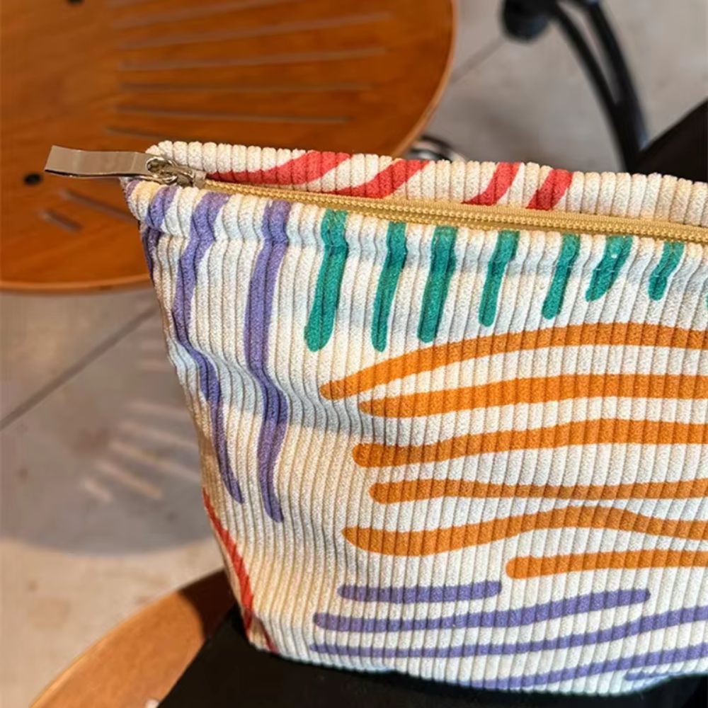 trousse de maquillage en velours rayée colorée