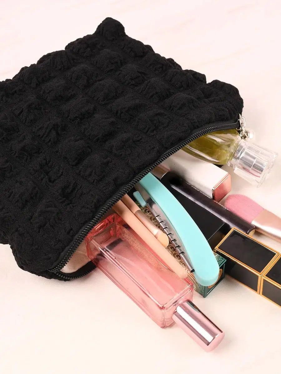 trousse de toilette en tissu matelassé
