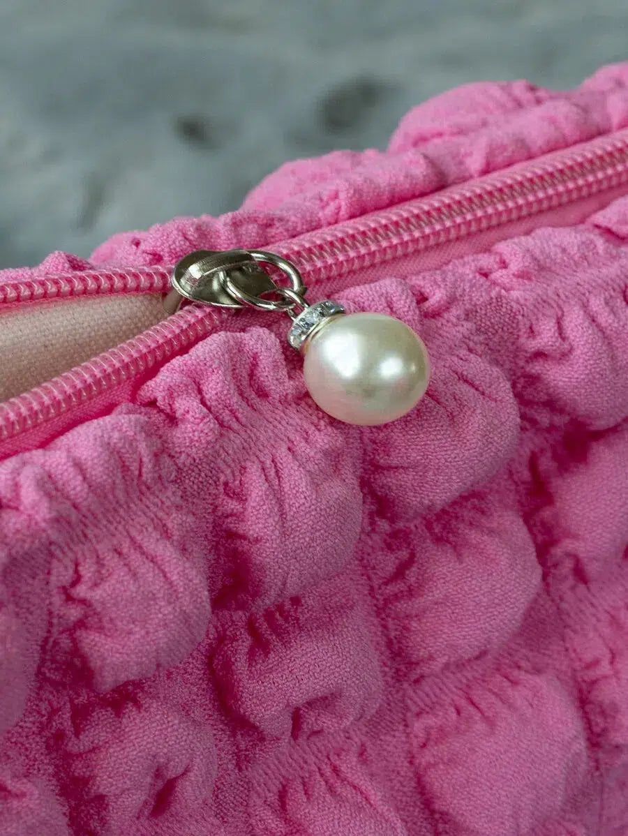 accessoire de beauté rose pour voyage