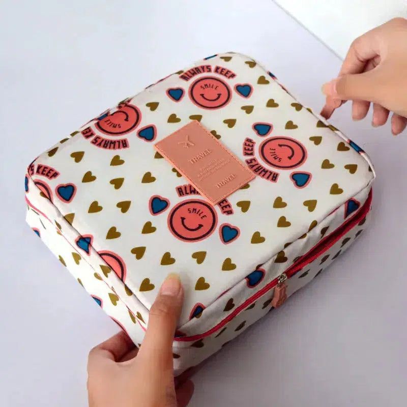 trousse de toilette rose avec motif smiley