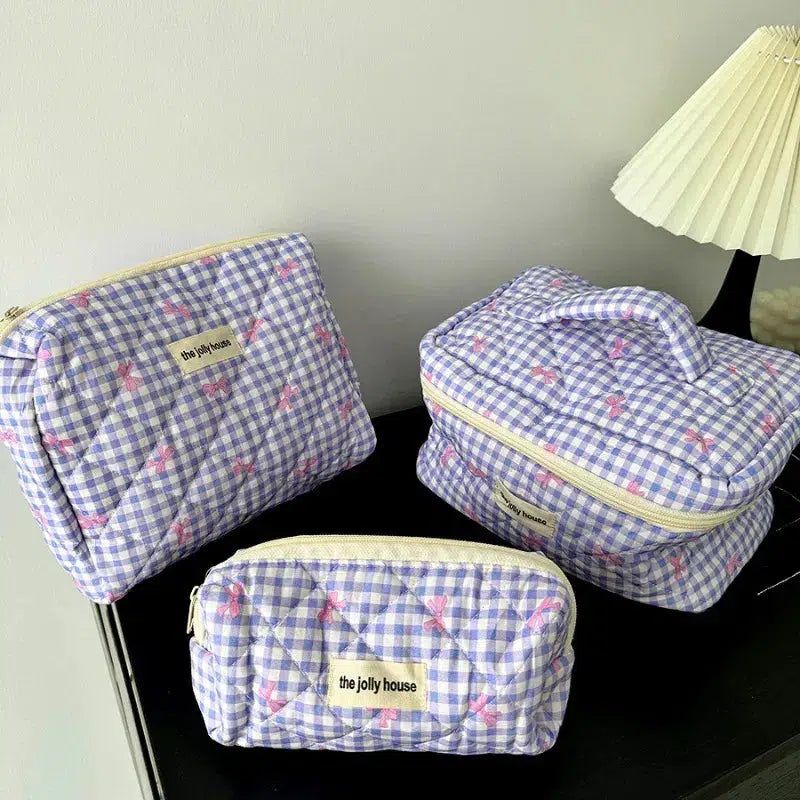 trousse de voyage femme en tissu matelassé violet
