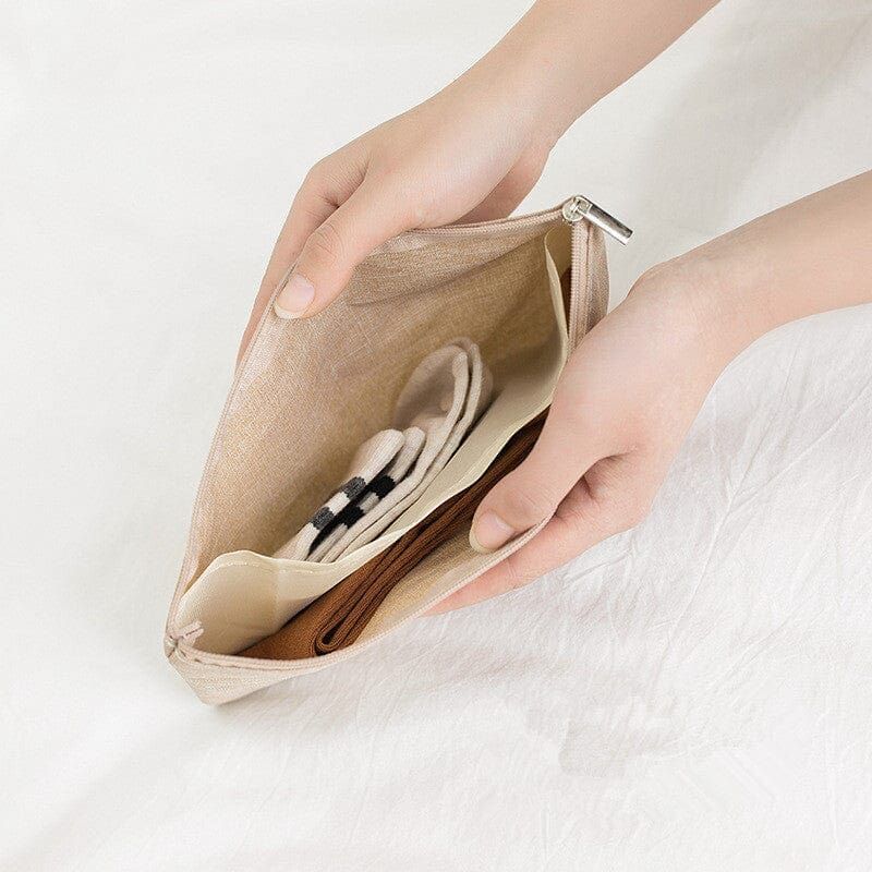 sac à linge pour voyages beige
