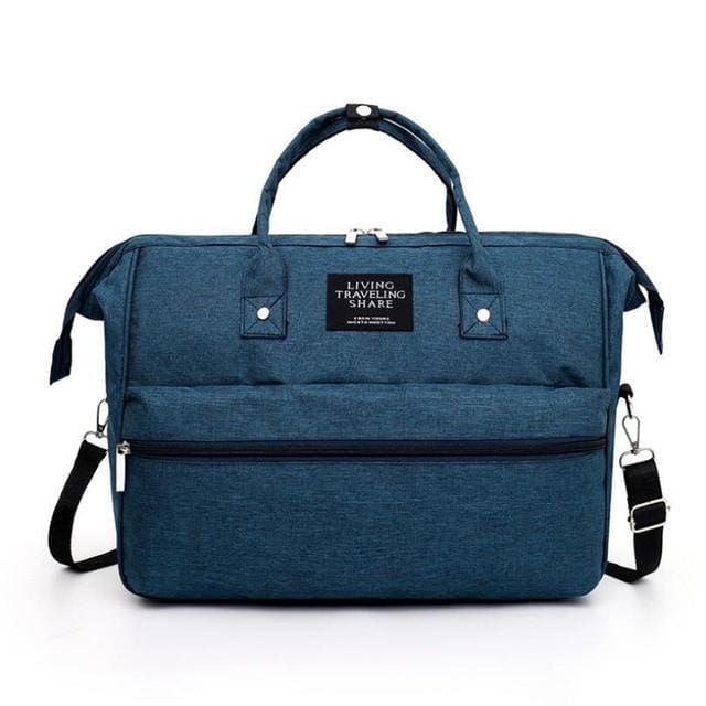 sac de voyage bébé living traveling share à bandoulière bleu