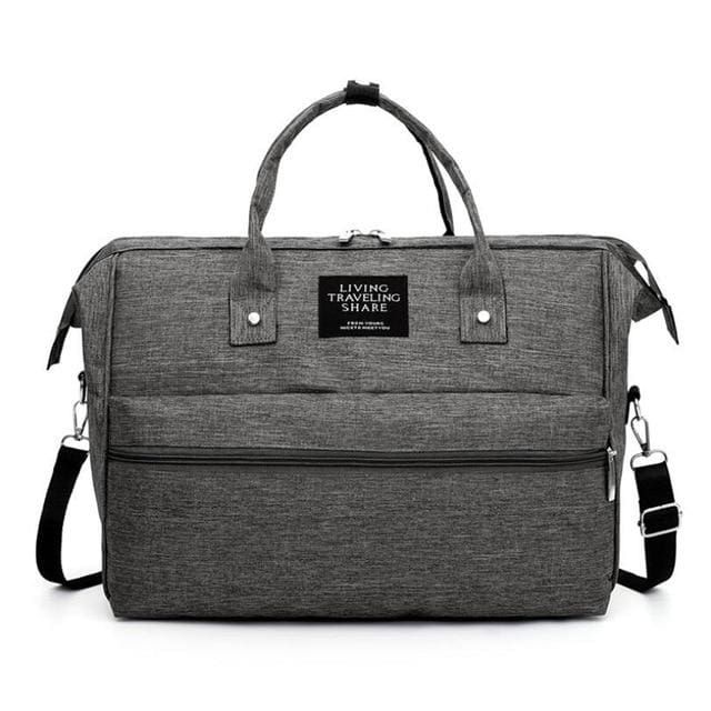 sac de voyage bébé living traveling share à bandoulière gris