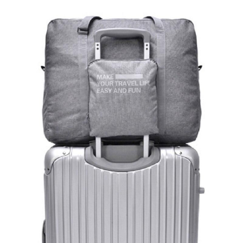 sac de voyage pliable couleur gris pratique pour le transit
